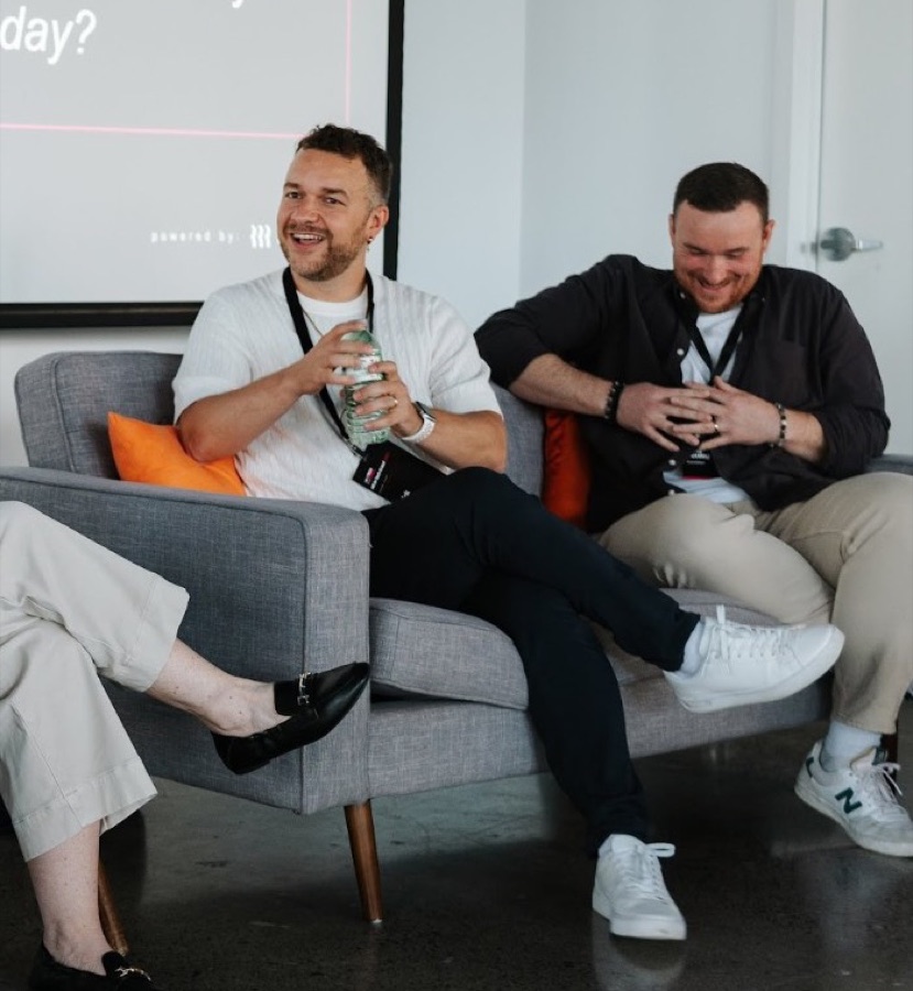 Nick and fellow panelists laughing on stage